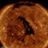 A vibrant image of a solar flare on the sun, with intense colors ranging from red to yellow, captured by NASA's Solar Dynamics Observatory, illustrating the sun's dynamic and powerful nature.